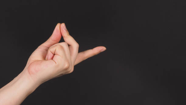 istock Male model is doing snap gesture with left hand sign on black background. 1766633127