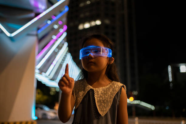 istock Little Girl Experience 3D Games with Glowing Glasses 1766635997