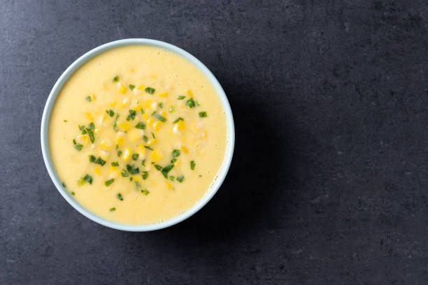 istock Corn soup in white bowl on black background 1766638098