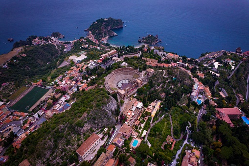 An aerial view of the Taormina ancient theatre and nearby buildings in Sicily