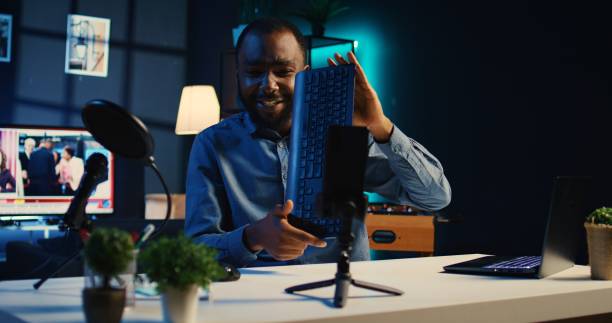 istock Man films peripherals review video 1766644333