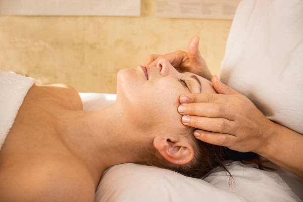istock masseur doing facial massage, Facebuilding Massage 1766646853