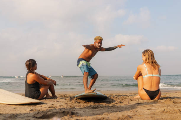 istock Indonesian Male Surfer Teaching How to Surf on the Beach 1766647673