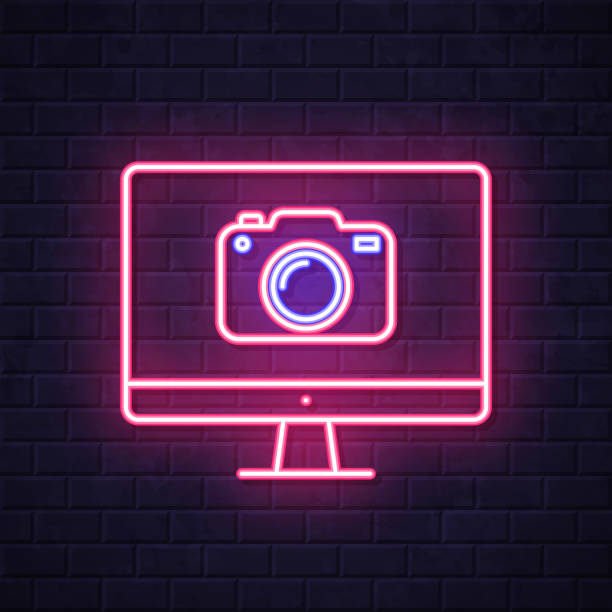 ilustrações de stock, clip art, desenhos animados e ícones de desktop computer with camera. glowing neon icon on brick wall background - conference call flash