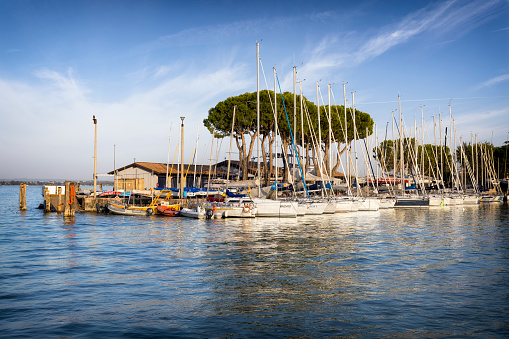 Saint Jean de Luz, France - May 20, 2016:  Fishing boats moored in Saint Jean de Luz - Ciboure fishing port with Maison de l'Infante Joanoenia (The House of the Infanta) in Quai de l'Infante in background.