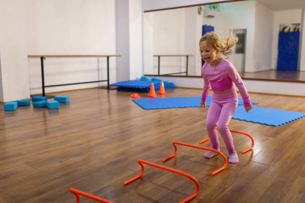 Cute little girl having fun practicing at the dance studio.