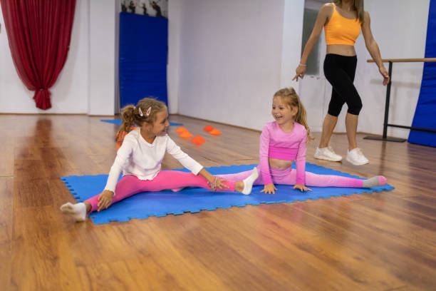 istock Girls stretching in dance studio 1766703539
