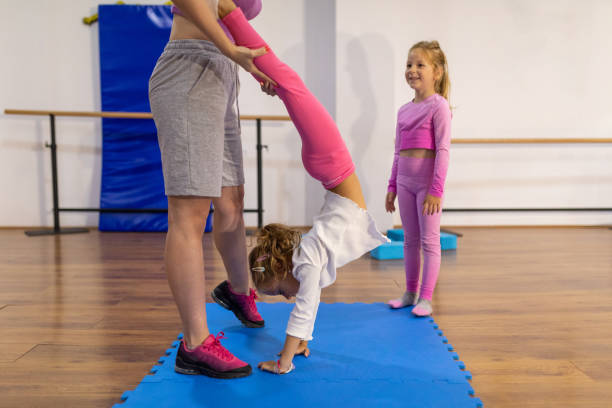 istock Girls with teacher in dance studio 1766707912
