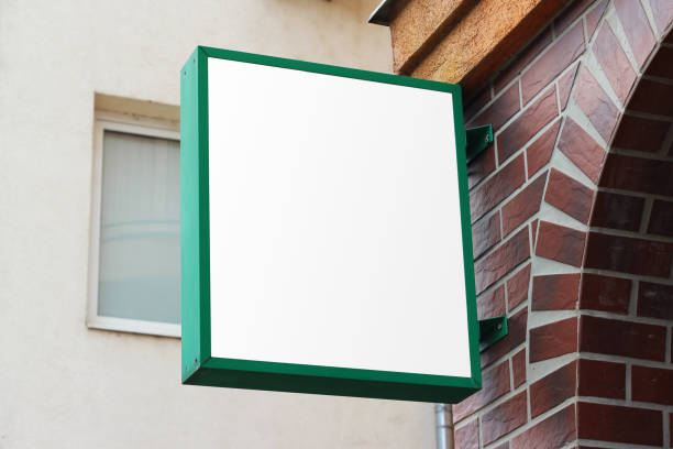 istock Storefront light box sign, shop, cafe, restaurant mounted signboard mock up design template. Blank white store sign design mockup. 1766708430