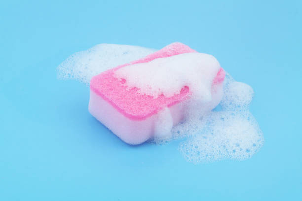 istock Pink sponge with foam on blue background. 1766708440