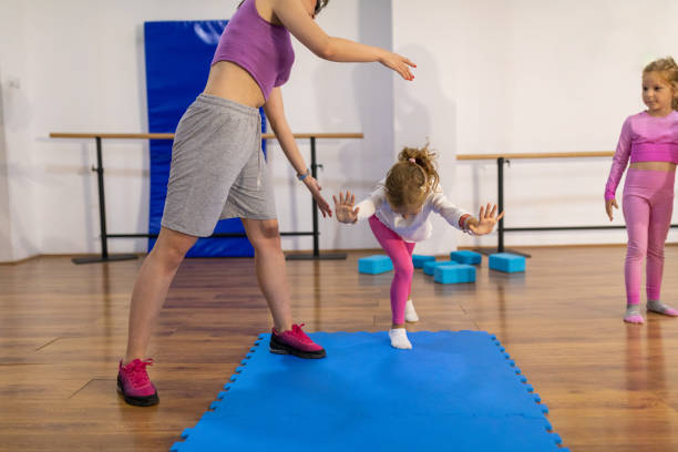 istock Girls with teacher in dance studio 1766708444