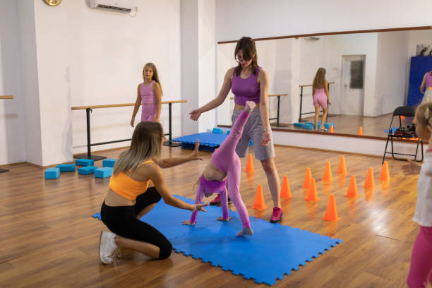 istock Girls learning handstand 1766709050