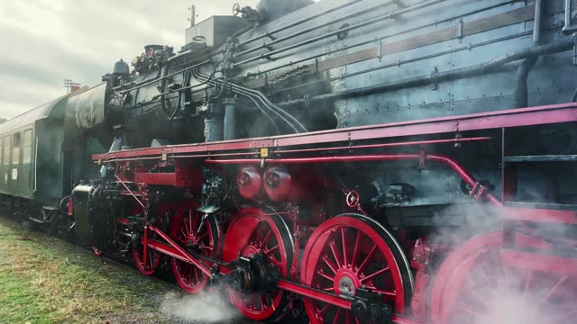 Historical German steam engine train locomotive with operating mechanisms