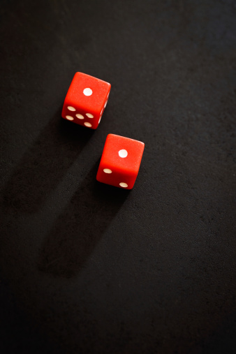 Two red dice show a possibly unlucky count of 2 on a black background.