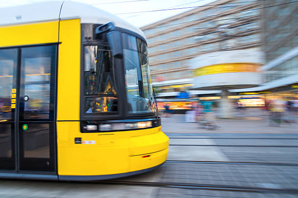 Yellow tram on the Alexanderplatz Yellow tram on the Alexanderplatz blurred motion street car green stock pictures, royalty-free photos & images