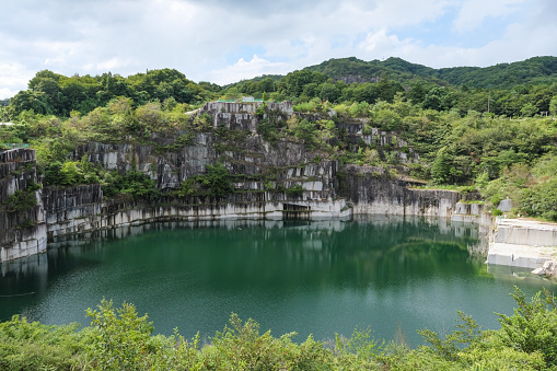 A lake filled with water at the site of a granite quarry