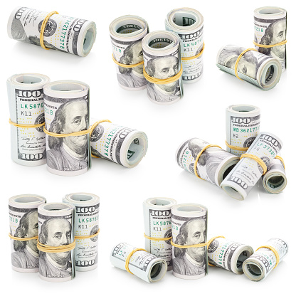 One hundred dollars bills cash rolls isolated on white background