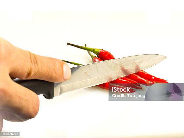 Red Chili Peppers With Hand Of Someone And Knife Stock Photo - Download Image Now - Close-up, Food, Freshness