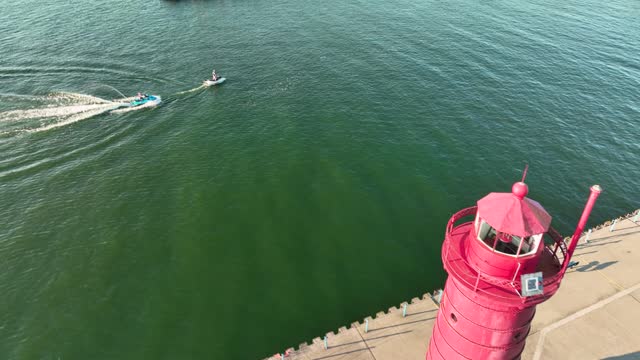 A Great Lakes Lighthouse jutting out into Lake Michigan.