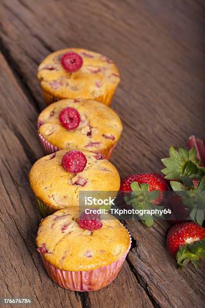 Four Fruit Muffins In A Row Stock Photo - Download Image Now - Baked, Baked Pastry Item, Cake