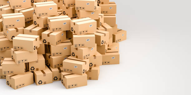 Cardboard boxes on white background with empty copy space on right side, logistics and delivery concept stock photo