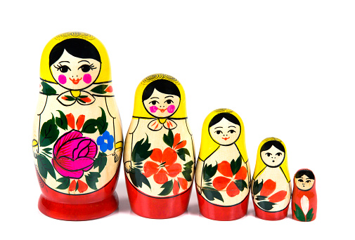 A set of matryoshka dolls depicting characters from a Russian folk tale. Isolated on white background.