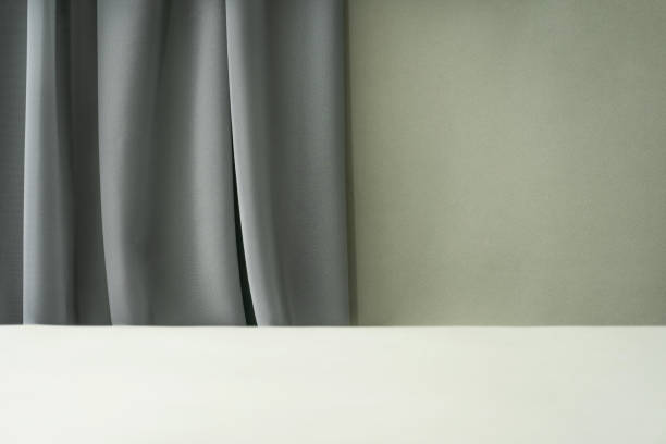istock Podium for exhibitions and product presentations, fabric material. Beautiful green background. Abstract minimal empty background composition for product presentation. 1766780582