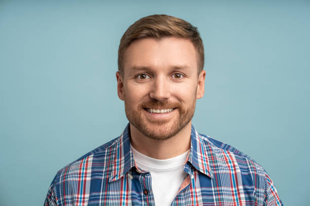 istock Portrait positive friendly caucasian bearded man looking at camera smiling on blue background. 1766784088