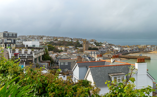 St. Ives.Cornwall. UK- 10.01.2023. A general view of St. Ives town buildings on a cloudy rainy day.