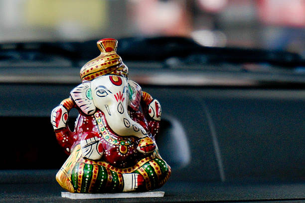 istock marble statue of Ganesha on a car dashboard 176678999