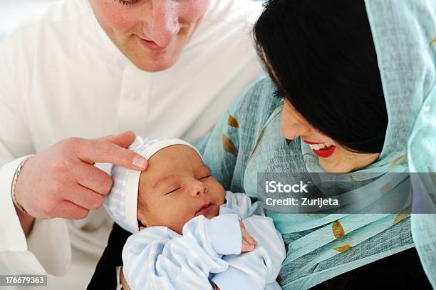 Arabic Muslim Couple With New Baby At Home Stock Photo - Download Image Now - Baby - Human Age, Arabia, Middle Eastern Ethnicity