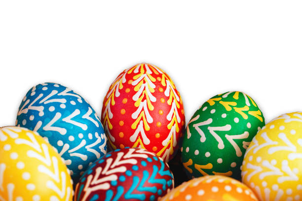 istock Handmade decoration easter eggs. Vibrant color painted chicken eggs for celebrating easter holiday. Empty copy space isolated on white. 1766800960