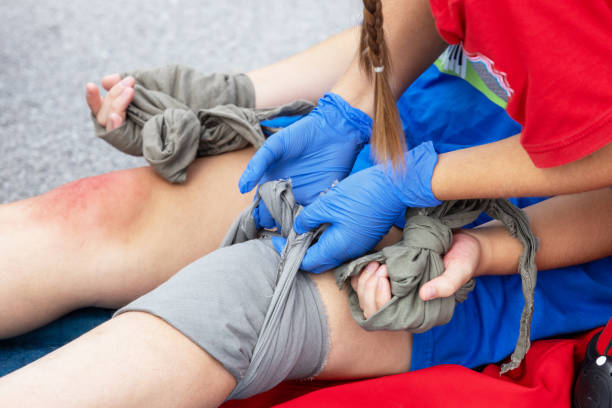 istock Leg and hand injury bandaging, first aid after accident 1766811366