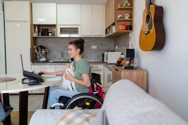 istock Disabled female freelancer working on a computer at home office. 1766812503