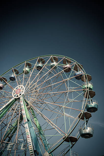 istock Ferris Wheel in Amusement Park on Clear Blue Sky 176681587