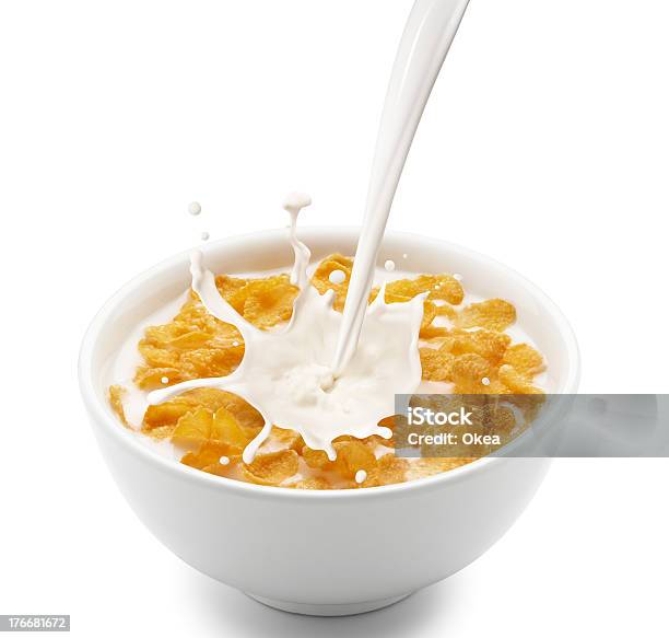 Milk Splashing From A Height Into A Bowl Of Cornflakes Stock Photo - Download Image Now