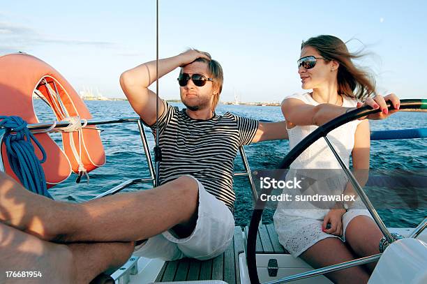Happy Young Couple Relaxing On A Yacht Stock Photo - Download Image Now - Adult, Adventure, Cheerful