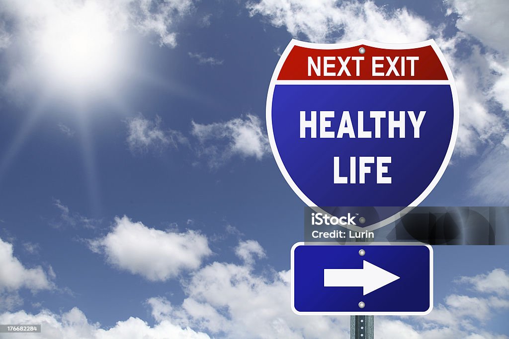 An interstate road sign pointing to healthy life Red and blue interstate road sign next exit healthy life Improvement Stock Photo