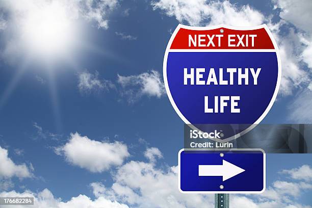 An Interstate Road Sign Pointing To Healthy Life Stock Photo - Download Image Now - Improvement, Achievement, Advice