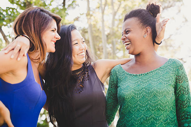 istock Three young women having fun at the park 176682534