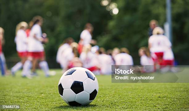 Closeup Of A Soccer Ball In Front Of A Female Soccer Team Stock Photo - Download Image Now