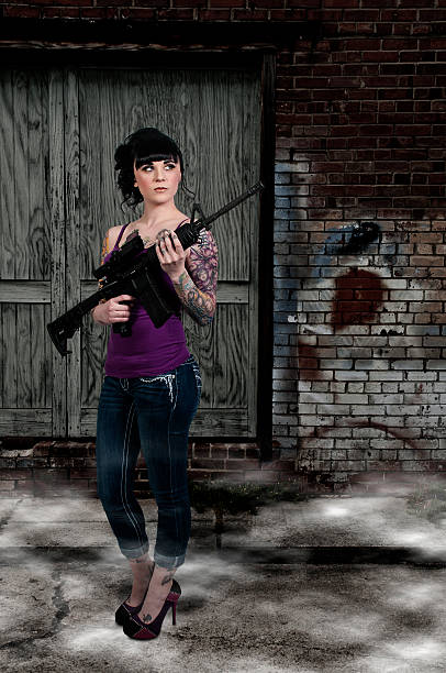 istock Woman with Assault Rifle 176683601