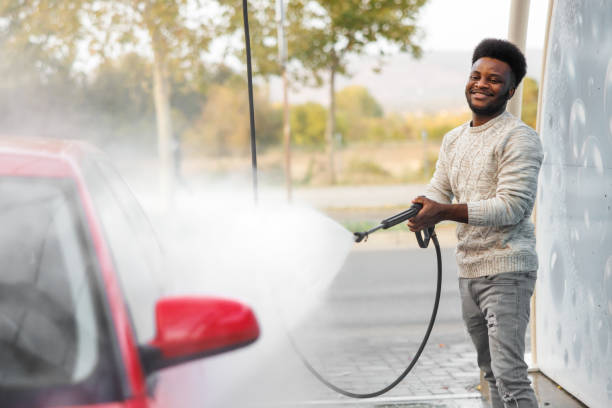 istock Man washes car with washing gun 1766847639