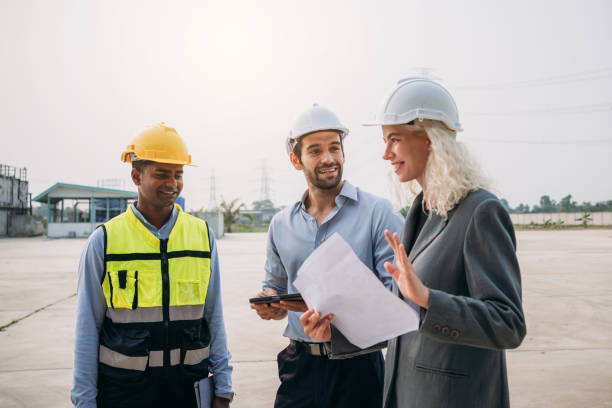 istock Engineer talks with the team to plan the factory setup. Professionals working planning and talking to design the arrangement of warehouse. 1766850424