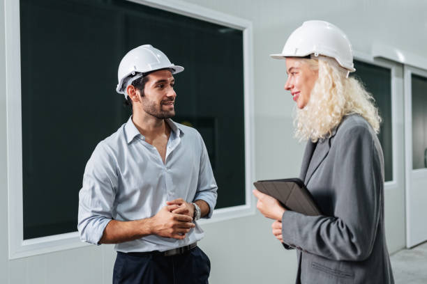 istock Team engineers workers planning and talking in empty warehouse to design the arrangement of product shelves and organize strategy about new manufacturing. 1766851182