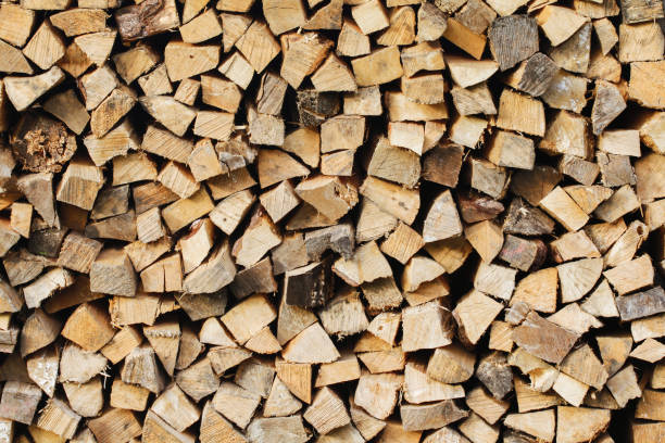 istock Firewood background. Wood industry background. Chopped wood texture. Stacked tree logs pattern. 1766856248