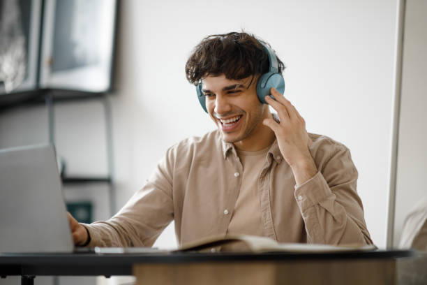 istock Joyful Middle Eastern Man Video Calling On Laptop In Office 1766860666