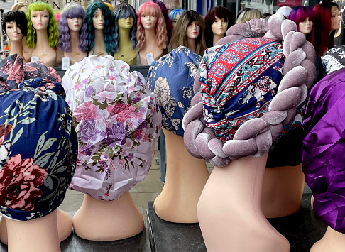 Hats and wigs on a market stall