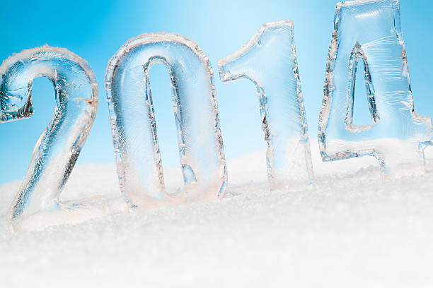 istock Year 2014 cut from ice on snow blue sunny background 176686955