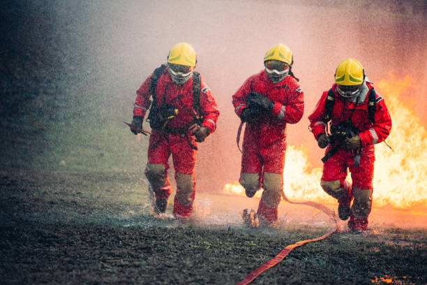 istock Firefighter in Full Protective Gear. Heroic Fireman Combats Intense Blaze with Life-Saving Equipment. 1766871689